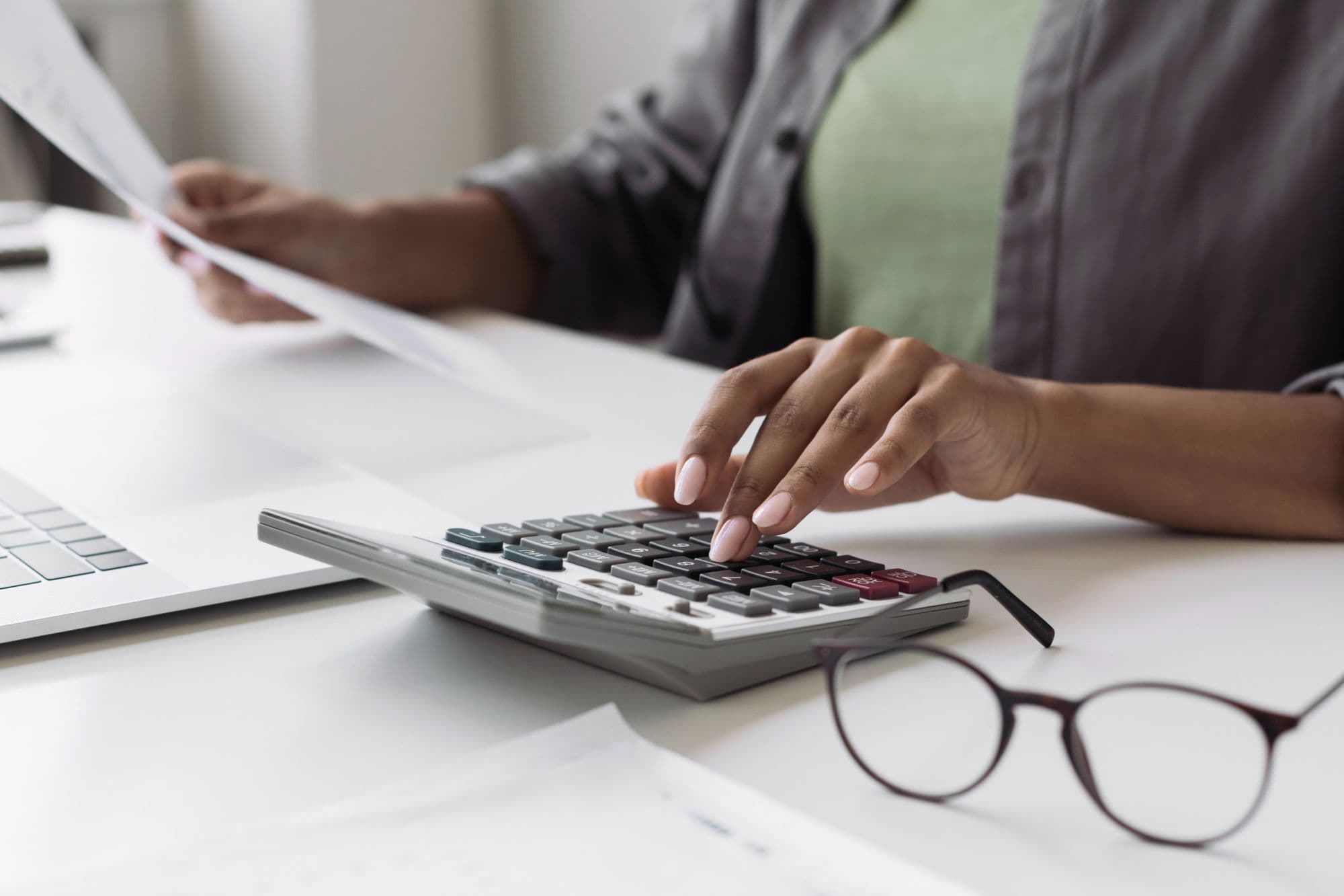 Accountant using a calculator